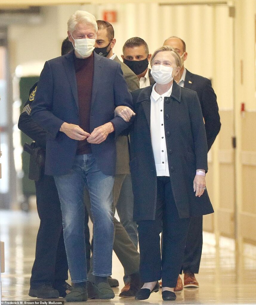 Bill Clinton is released from hospital after a five-night stay to treat urological infection: Former president is escorted out of facility arm in arm by wife Hillary Clinton